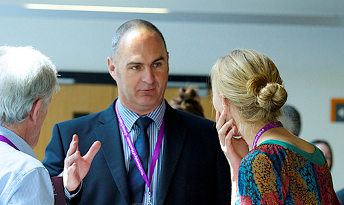 Delegates at a meeting having a conversation
