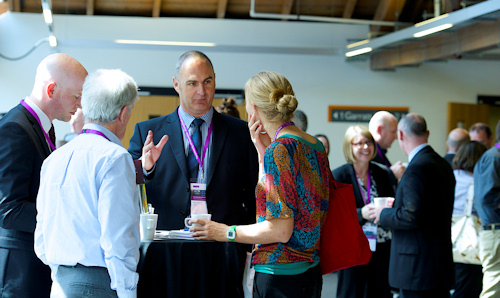 Delegates at a meeting having a conversation