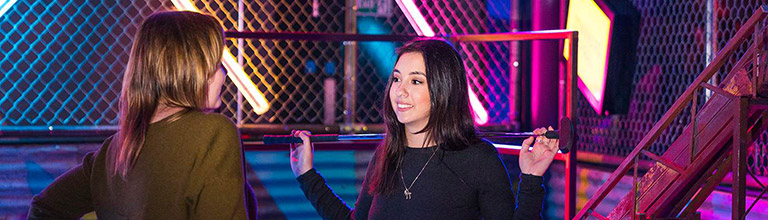 Two female students playing crazy golf